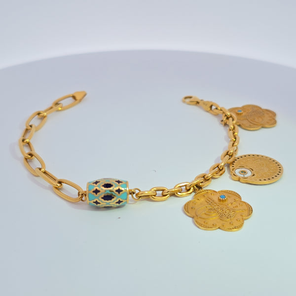 21K bracelet with charms 13.46g